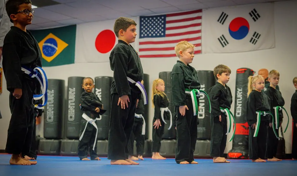 Little Dragons lined up at attention on the blue mats